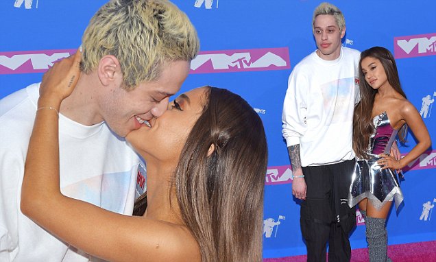 Pete Davidson kissed and snuggled as they strolled the pink cover