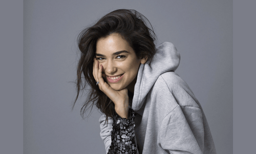 Dua Lipa, one of the most beautiful women in the world, radiating confidence and elegance during a photoshoot.