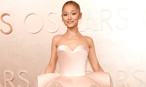 Ariana Grande wearing a Glinda-inspired gown embellished with 190,000 crystals on the Oscars 2025 red carpet.