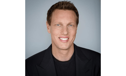 David Ellison, new CEO of Paramount, smiles in a professional headshot following the Skydance–Paramount merger.