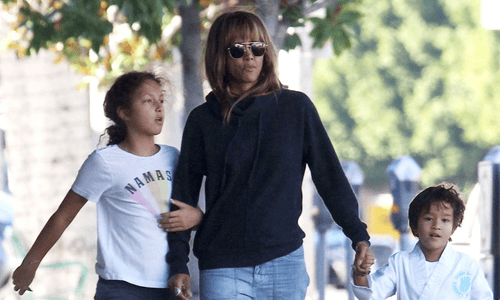 Halle Berry walking outdoors with her daughter Nahla and son Maceo.