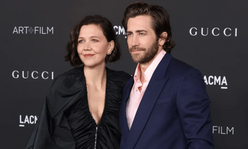 Maggie and Jake Gyllenhaal, a sister and brother acting duo, pose together at a gala event. 