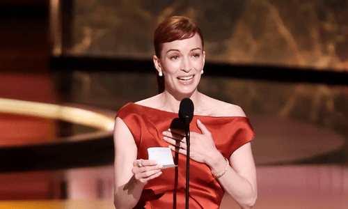 Britt Lower holding Emmy Award 2025 for Best Lead Actress in a Drama Series for Severance.