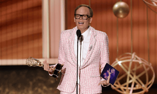 Jeff Hiller holding Emmy Award 2025 for Best Supporting Actor in a Comedy Series for Somebody Somewhere.