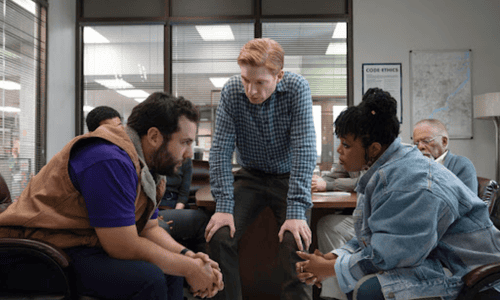 Cast of Netflix’s The Paper in a tense newsroom scene from the new workplace drama.