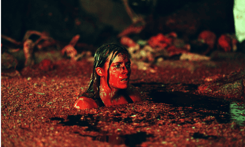 The Descent horror movie still with spelunkers facing cave monsters.