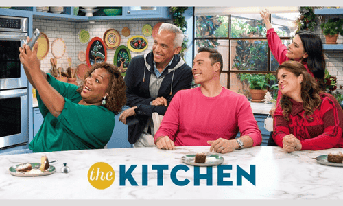 Promotional photo for Food Network’s The Kitchen featuring the hosting panel of celebrity chefs.