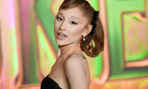 Ariana Grande posing at a Wicked: For Good premiere before pausing promotions due to COVID-19.