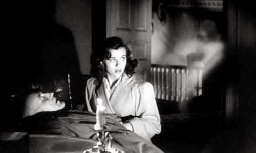 Scene from The Uninvited (1944) showing the eerie seaside mansion central to the haunting.