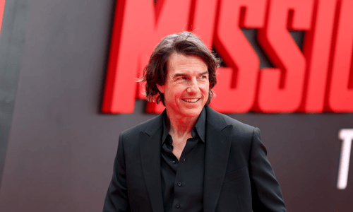 Tom Cruise celebrating and dancing after receiving his honorary Oscar at the Governors Awards.