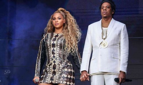 Beyoncé and Jay-Z appearing together at a formal event, standing confidently as a long-time celebrity couple.