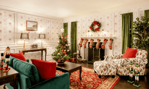 The Home Alone house living room interior, famous for its holiday chaos scenes, restored to reflect the movie’s original 1990s design.