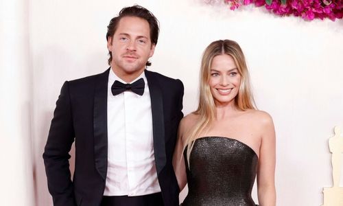 Margot Robbie and Tom Ackerley attending an event together, captured in a low-key public appearance.