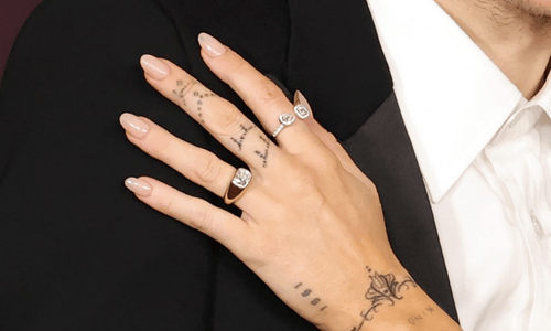 Close-up view of Miley Cyrus’s bold cushion-cut diamond engagement ring designed by Jacquie Aiche.