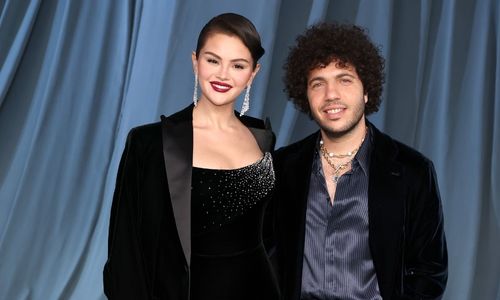 Selena Gomez and Benny Blanco attending a public event together, appearing cheerful and comfortable.