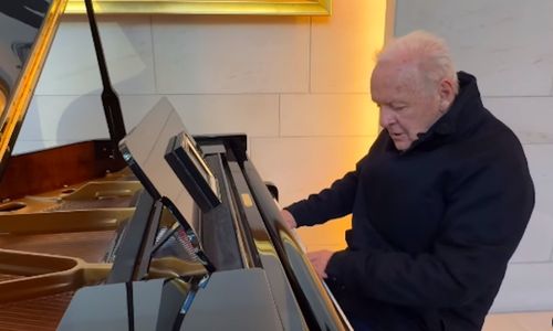 Anthony Hopkins photographed casually, reflecting his lesser-known interest in music composition.