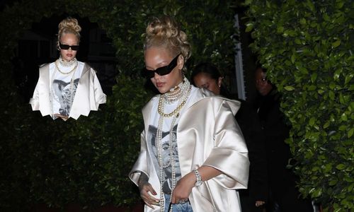 Celebrity streetwear look featuring an oversized satin coat styled in an editorial way