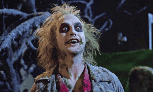 Beetlejuice in a surreal afterlife scene showcasing Tim Burton’s chaotic humour and horror fantasy style.