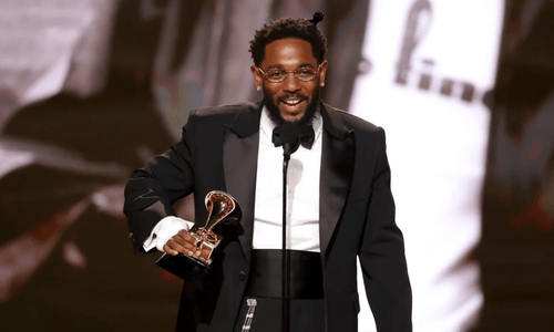 Kendrick Lamar celebrating his historic Grammy wins in 2026.