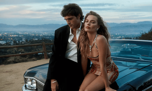 Robbie and Jacob Elordi as Catherine and Heathcliff in a tense, emotionally charged scene.