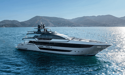 A sleek silver Riva Argo 90 yacht named 'Seven,' owned by David Beckham, cruising the Miami coastline.