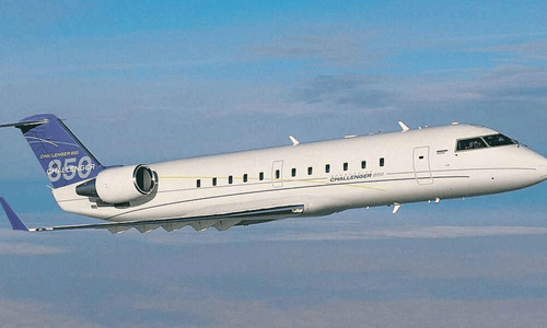 A white Bombardier Challenger 850 business jet, a luxury gift from Beyoncé to Jay-Z, sitting on an airfield.