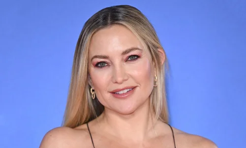 Kate Hudson looking emotional and contemplative in a scene from the film 'Song Sung Blue.'