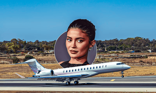 The 'Kylie Air' Global 7500 business jet featuring a custom pink and white exterior parked at a private hangar.