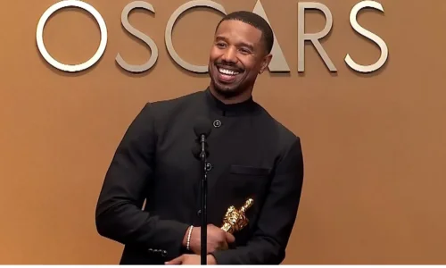 Michael B. Jordan accepting Best Actor Oscar, joining historic Black actors in Academy Awards history.