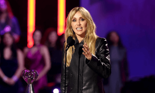 Miley Cyrus holding the Innovator Award at the 2026 iHeartRadio Music Awards.