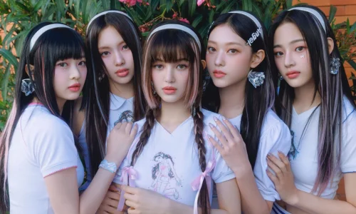 NewJeans members showcasing their signature Y2K fashion aesthetic in a promotional group photo.