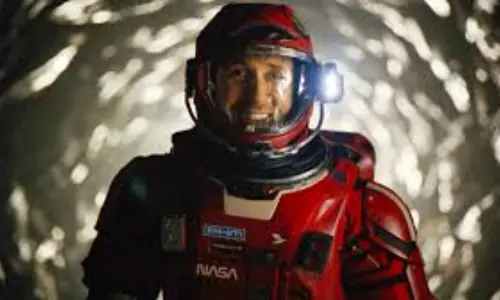 Ryan Gosling as Ryland Grace wearing a high-tech white spacesuit in a first-look still from the 'Project Hail Mary' movie.