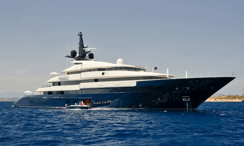 The 'Seven Seas,' a 282-foot luxury motor yacht owned by director Steven Spielberg, docked at a pier.