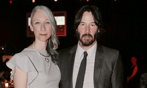 Alexandra Grant and Keanu Reeves photographed during a casual outing, sparking fan engagement theories.