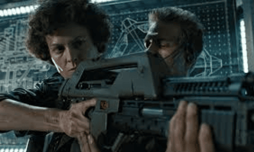 Sigourney Weaver as Ellen Ripley holding a pulse rifle and looking alert in a dark, industrial corridor in the film Aliens.