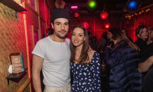 Aubrey Plaza in a patterned navy dress and Christopher Abbott at a Sundance event.