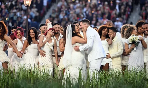 This image captures a live wedding ceremony taking place on stage during the Super Bowl halftime show. 