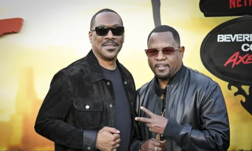 Eddie Murphy and Martin Lawrence laughing together at a public event in 2025.