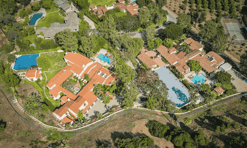 The exterior of the historic Ennis House in Los Angeles, showing its famous Mayan Revival textile block design.