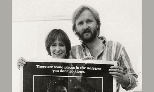 Producer Gale Anne Hurd and director James Cameron posing together at a public event.