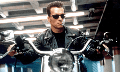 Director James Cameron giving instructions to Arnold Schwarzenegger on the set of Terminator 2.