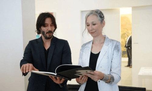 Alexandra Grant and Keanu Reeves attending an art gallery opening together.