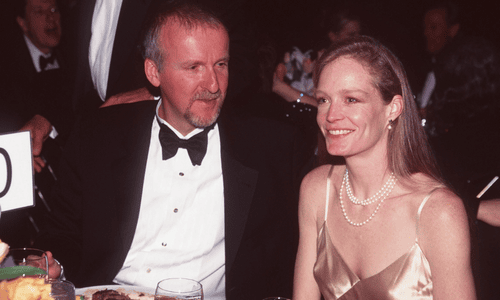 Marilyn Monroe and James Dean walking together and smiling on a street in New York City in 1955.