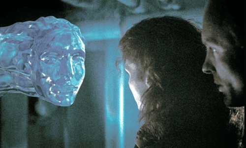 Actor Ed Harris wearing a high-tech diving suit and helmet inside a flooded underwater station in the film The Abyss.