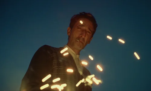 Actor Adrien Brody in character as architect Laszlo Toth in a dramatic scene from the movie The Brutalist.