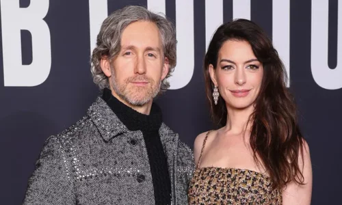 Anne Hathaway and her husband, Adam Shulman, posing together
