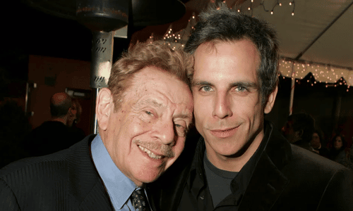 Ben Stiller and his late father Jerry Stiller smiling together at a Hollywood comedy premiere.