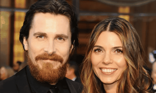 Christian Bale and wife Sibi Blazic posing together at a Hollywood movie premiere.