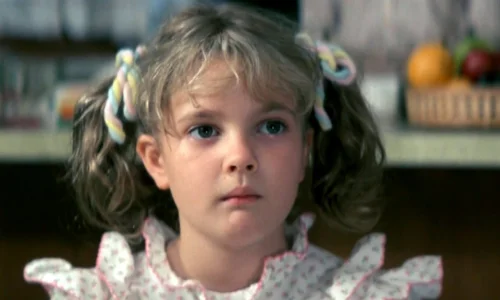 A vintage screen capture of young Drew Barrymore during her breakout role in E.T.