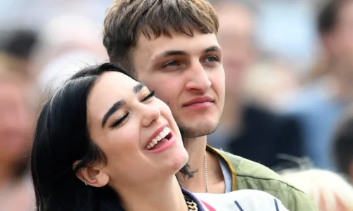 Dua Lipa and Anwar Hadid attending a high-profile event during their relationship.